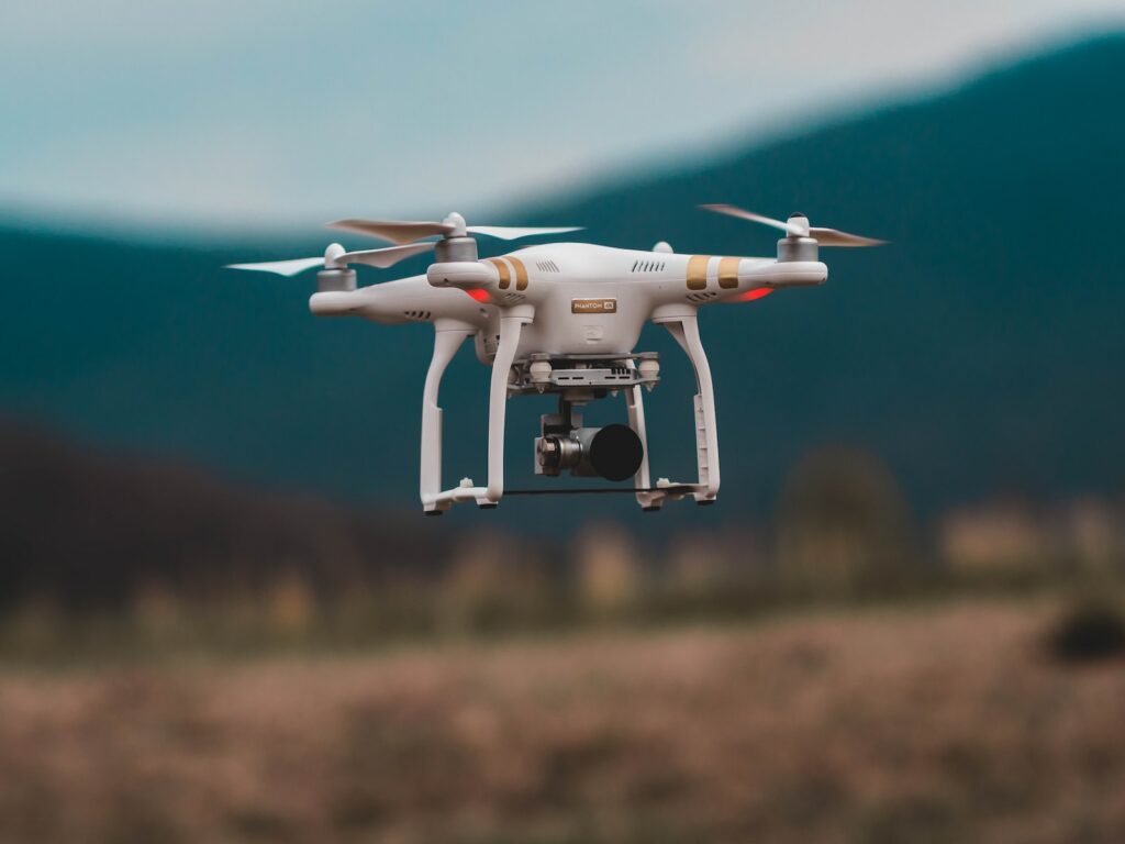 selective focus photography of DJI Phantom 3 Professional quadcopter drone